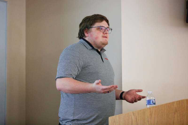 a man standing at a podium