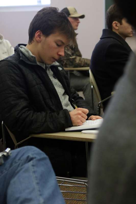 a man writing on a book