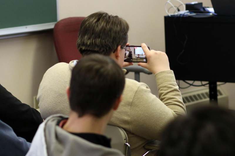 a man taking a picture of a person