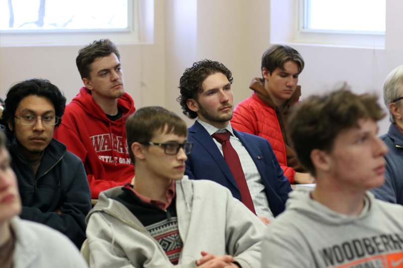 a group of people sitting in a room