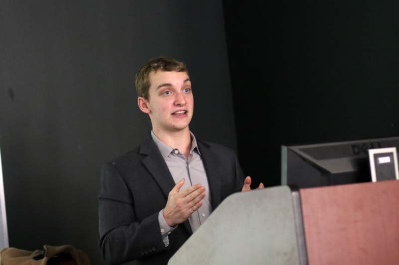 a man standing at a podium