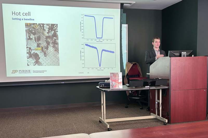 a man standing in front of a screen