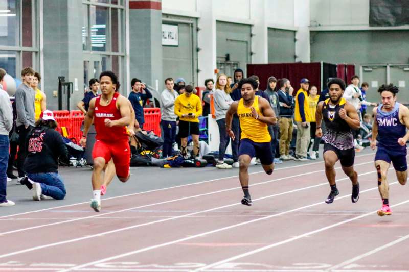 a group of men running on a track