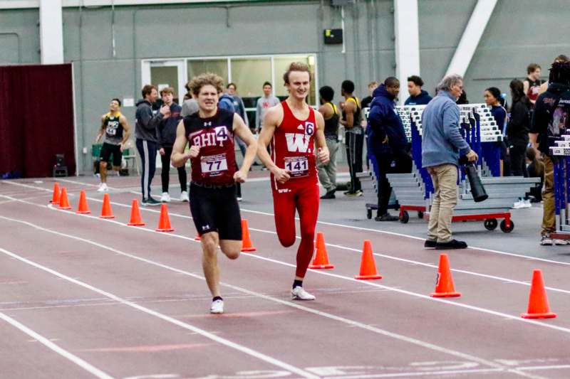 two men running on a track