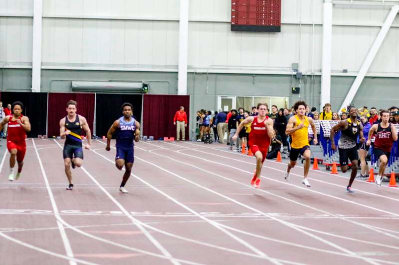 a group of people running on a track