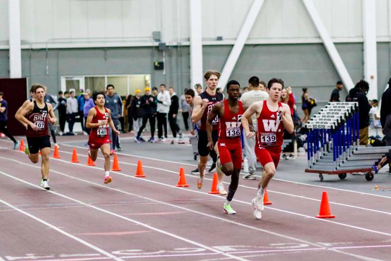 a group of people running on a track