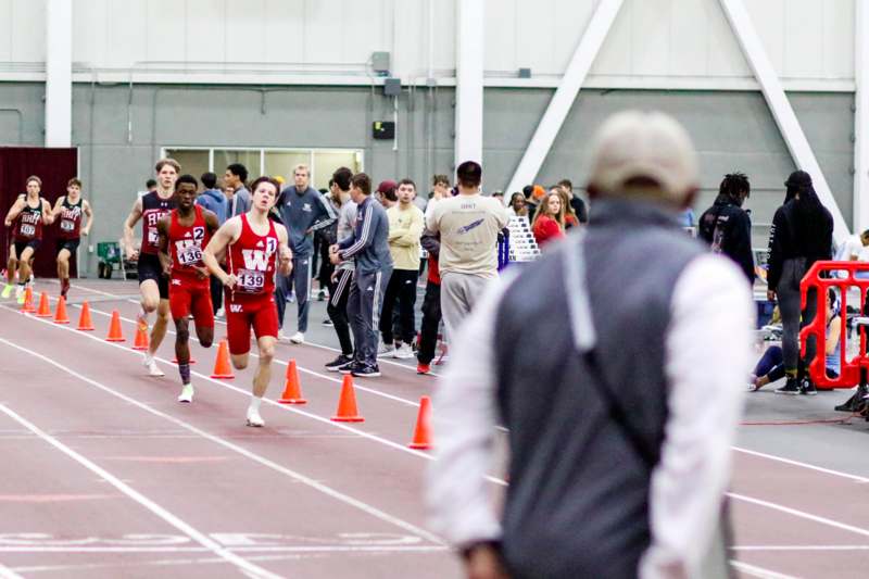 a group of people running on a track