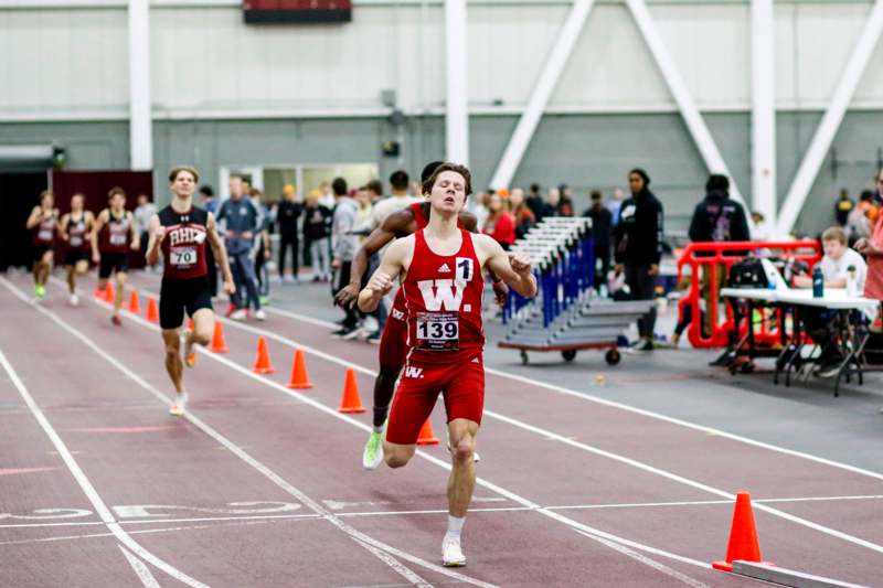 a group of people running on a track