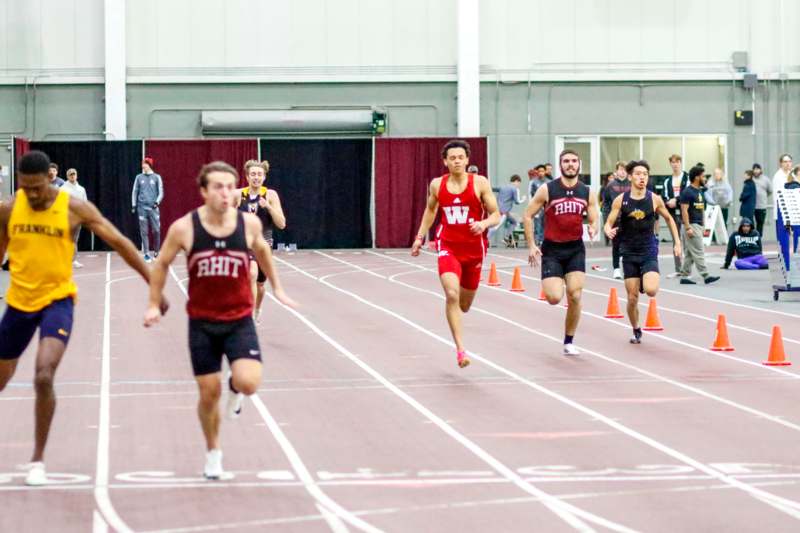 a group of people running on a track