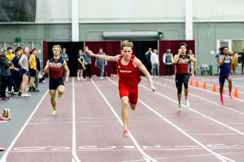 a group of men running on a track