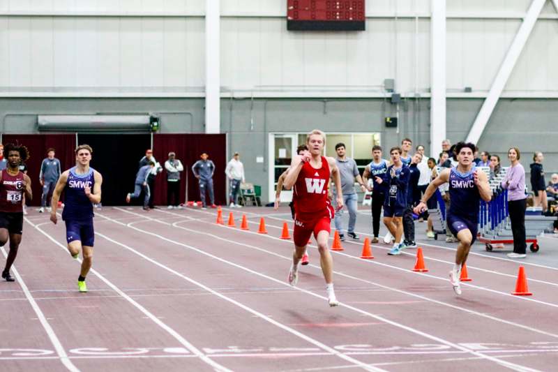 a group of people running on a track