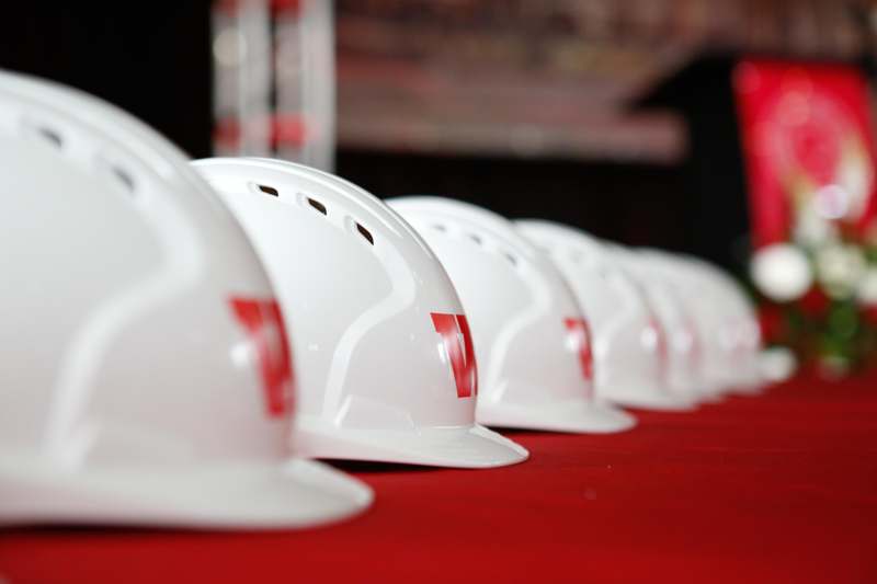 a row of white hard hats