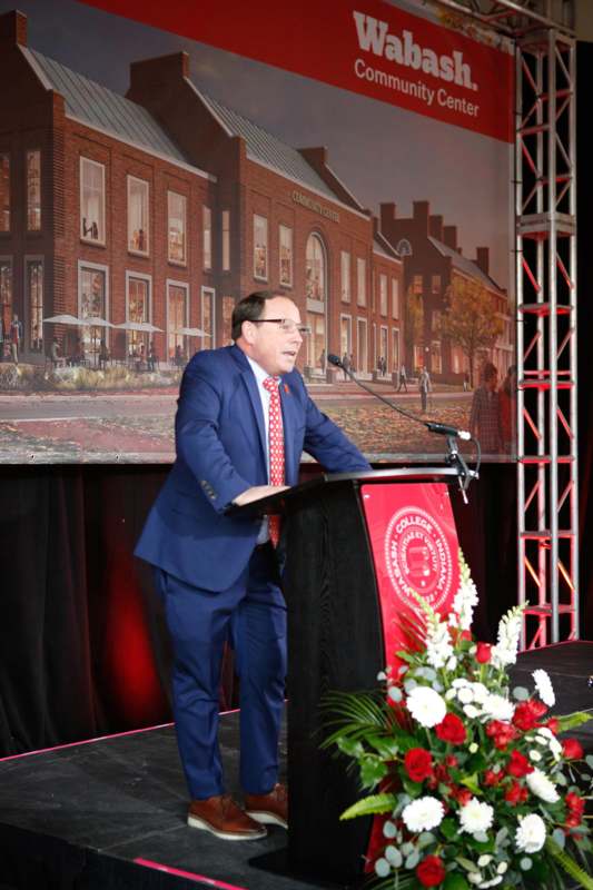 a man standing at a podium