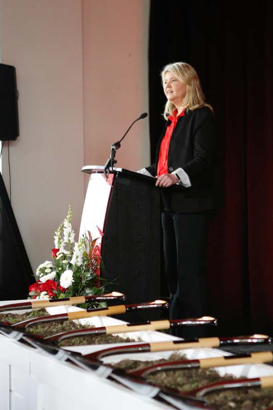 a woman standing at a podium