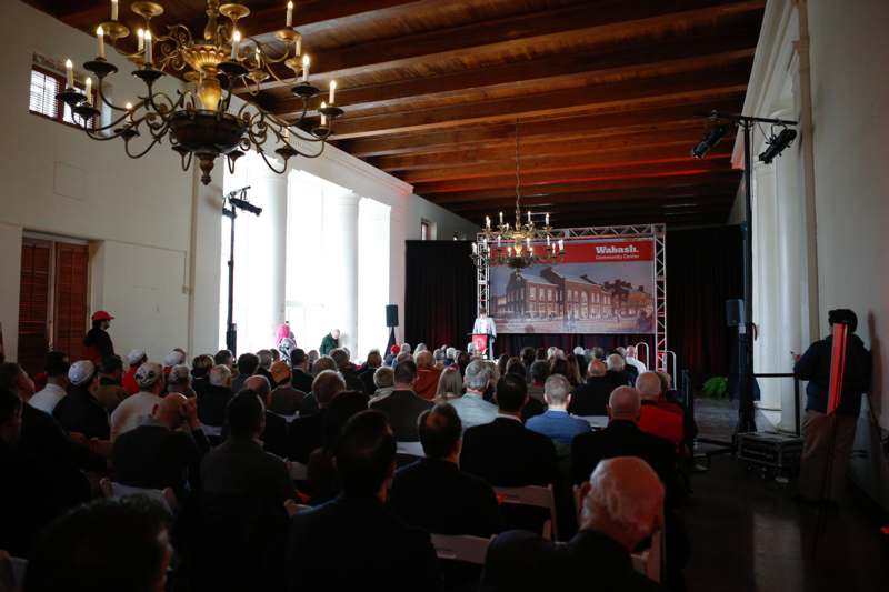 a group of people sitting in chairs in a room