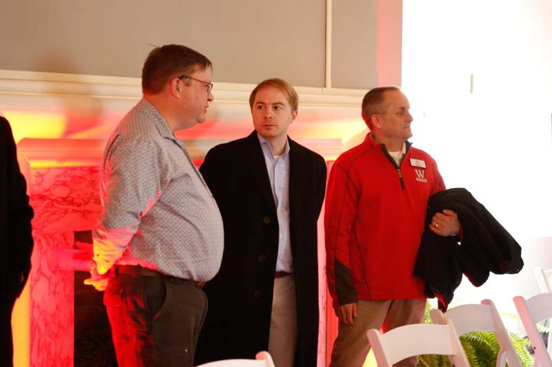 a group of men standing in a room