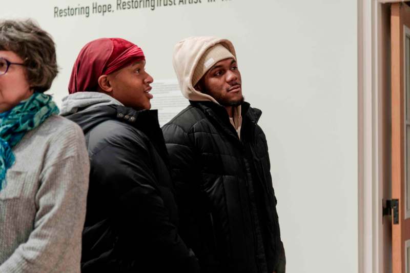 a group of men in winter coats