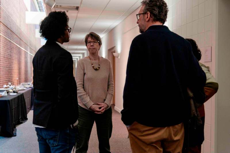 a group of people in a hallway