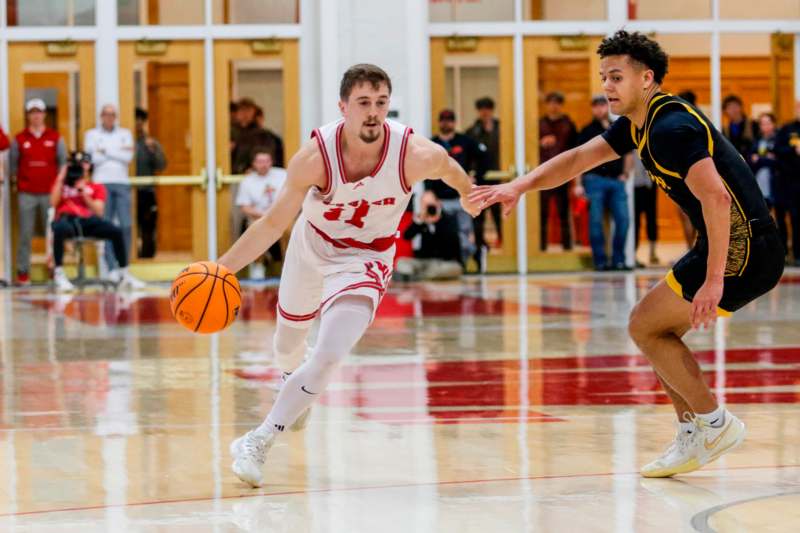 a basketball player dribbling a ball