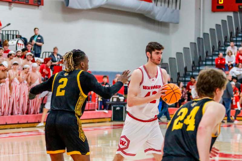 a group of people playing basketball