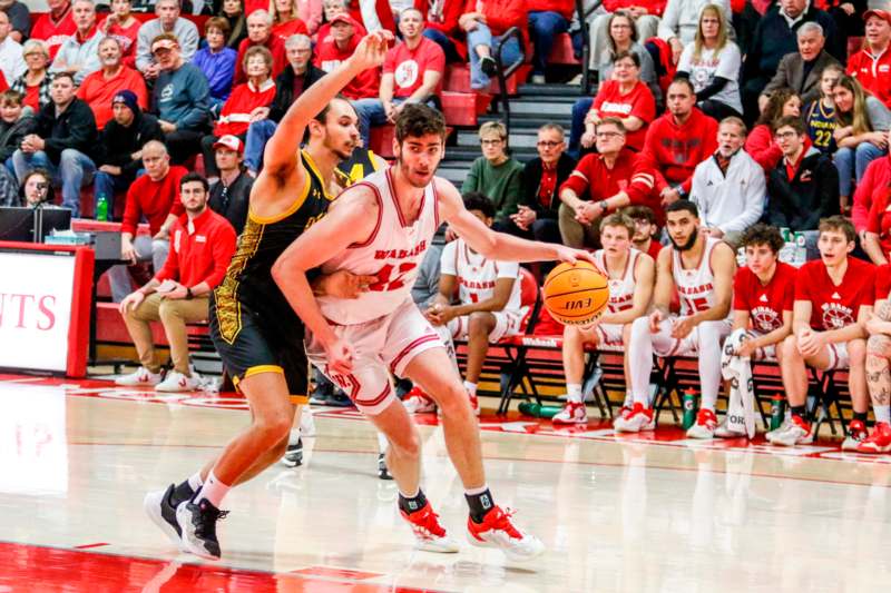 a basketball player dribbling a ball