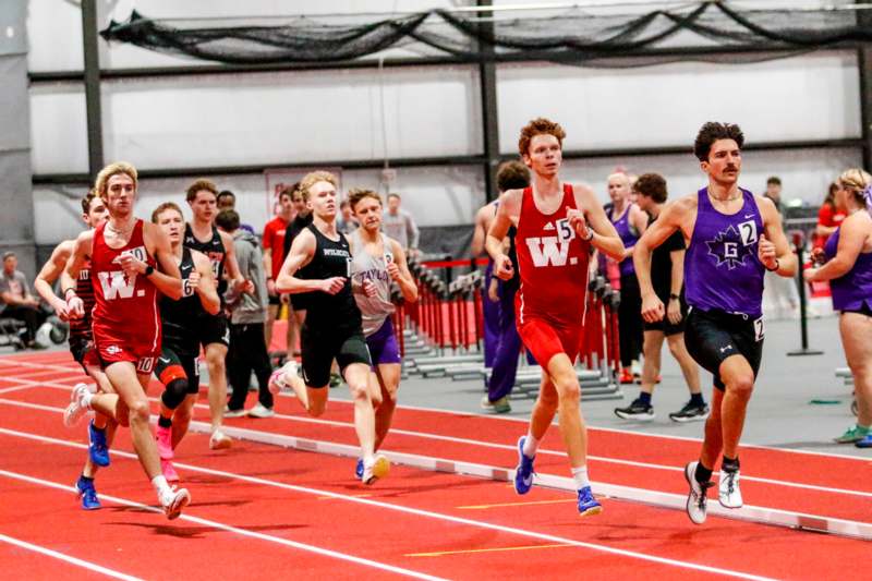 a group of people running on a track