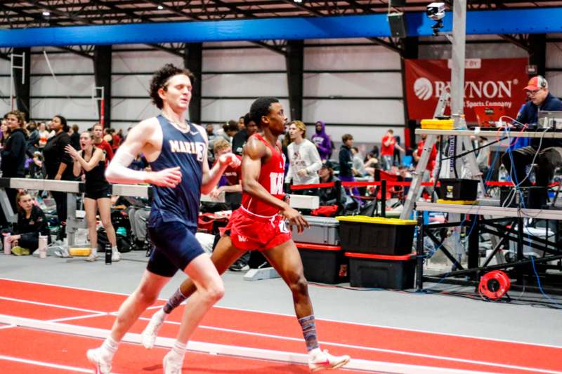 a group of people running on a track