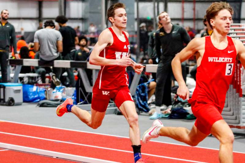 a group of men running on a track