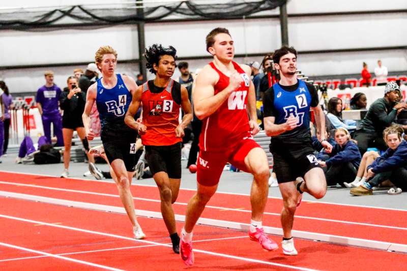 a group of people running on a track