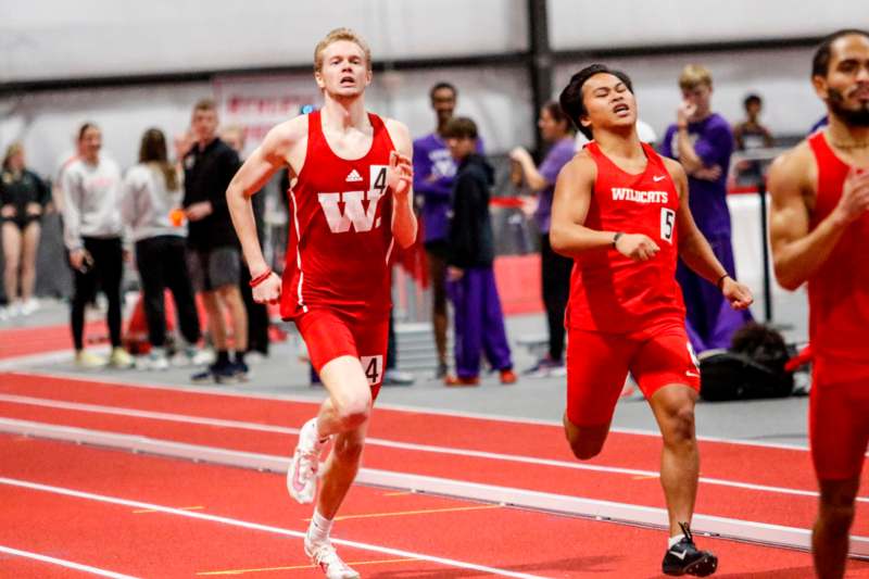 two men running on a track