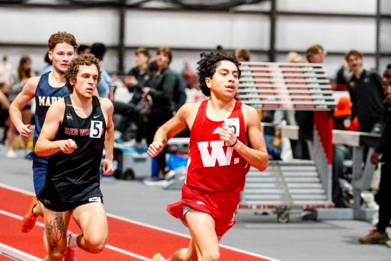 a group of people running on a track