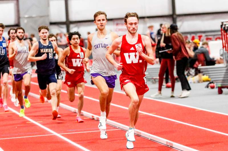 a group of people running on a track