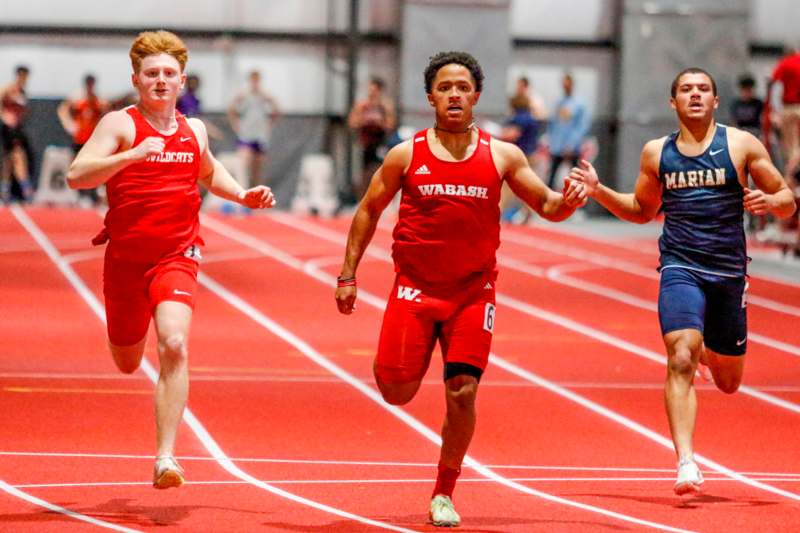 a group of men running on a track