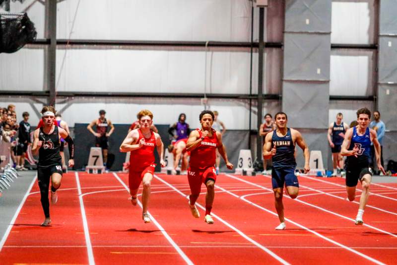 a group of people running on a track