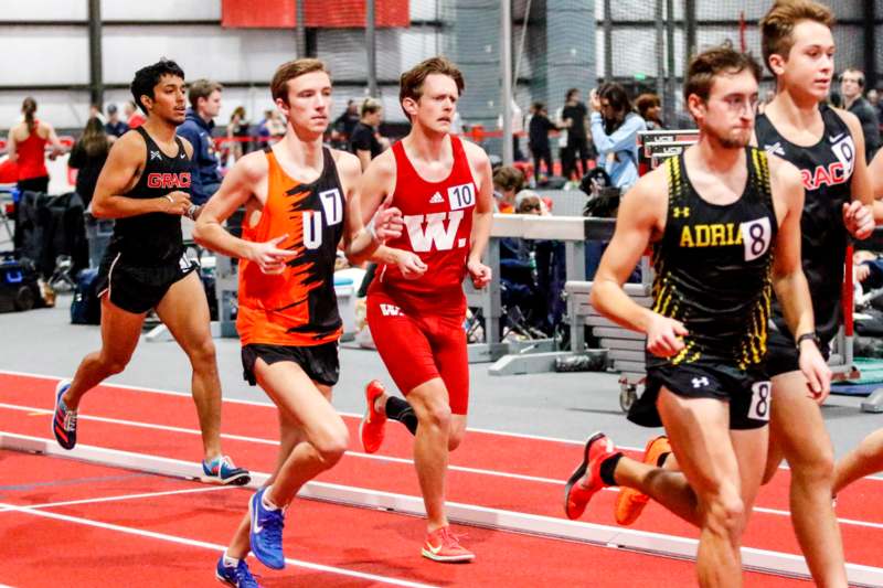 a group of men running on a track