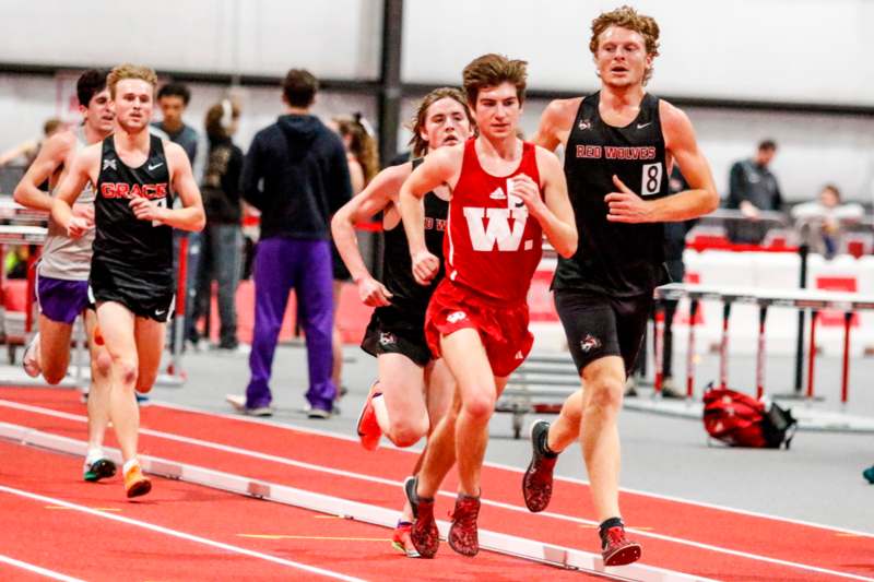 a group of people running on a track