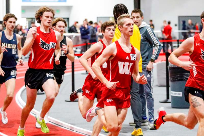 a group of people running on a track