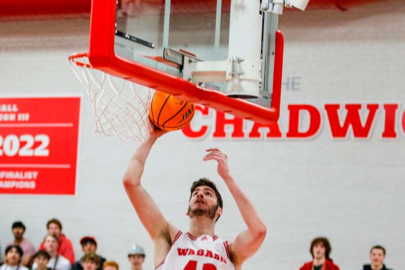 a man dunking a basketball