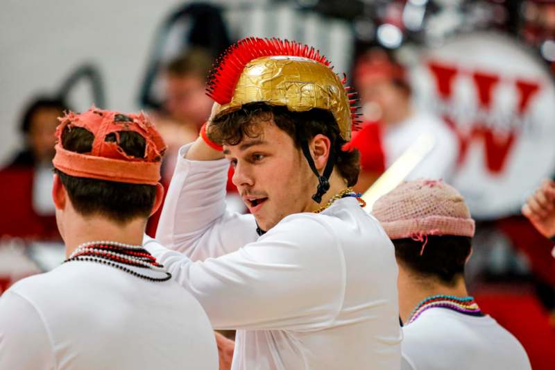 a man wearing a gold helmet