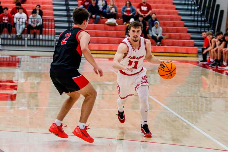 a basketball player dribbling a basketball