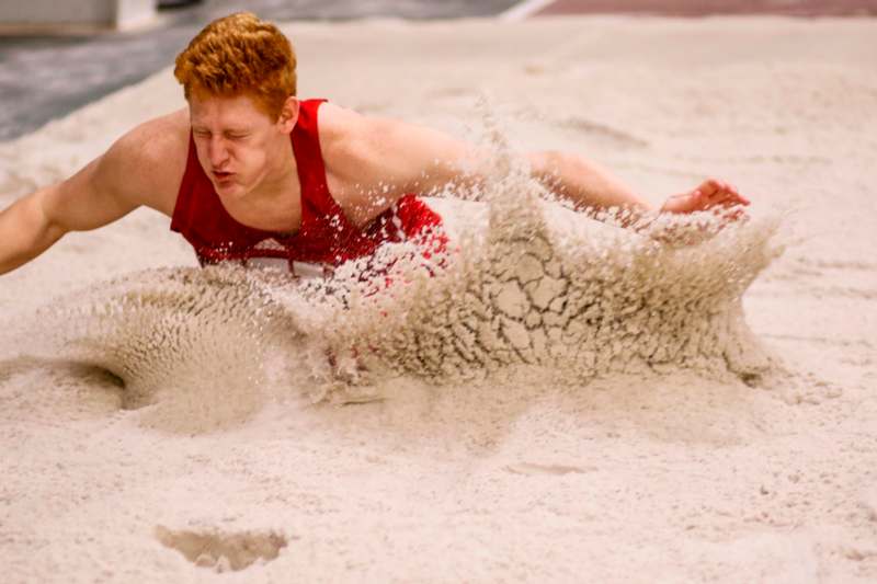 a man falling in sand