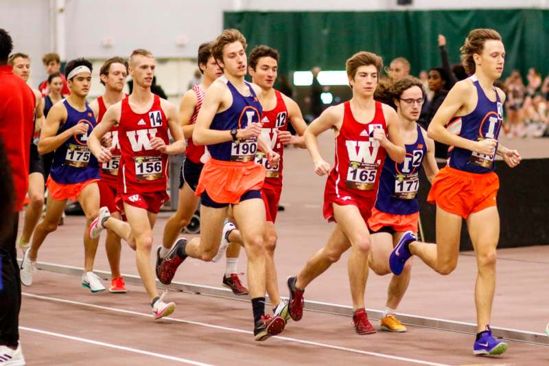 a group of people running on a track