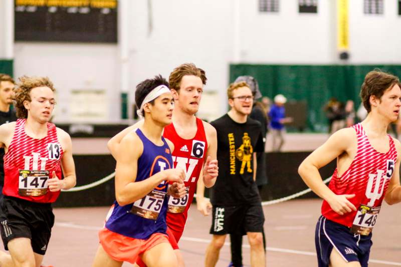 a group of people running on a track