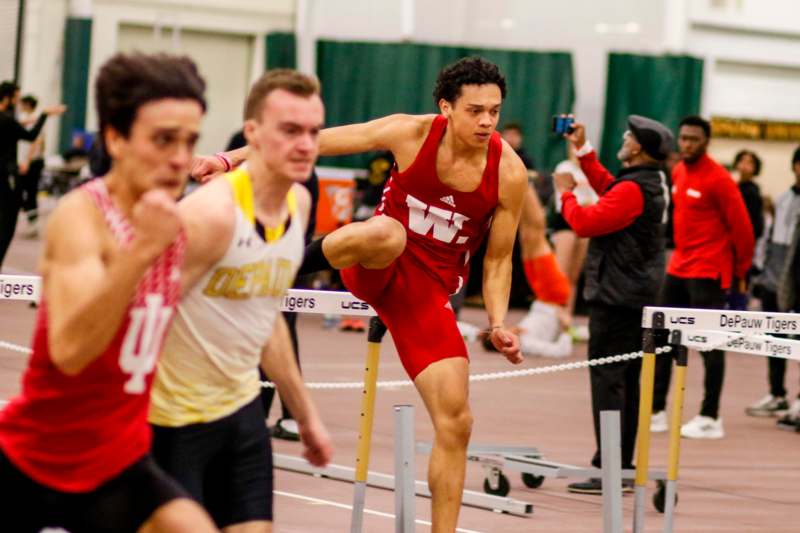 a group of men running on a track