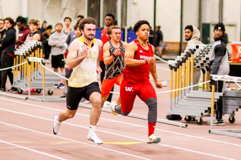 a group of people running on a track