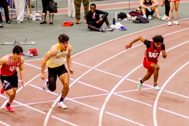 two men running on a track