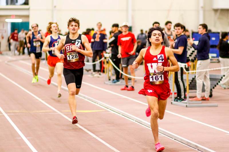 a group of people running on a track