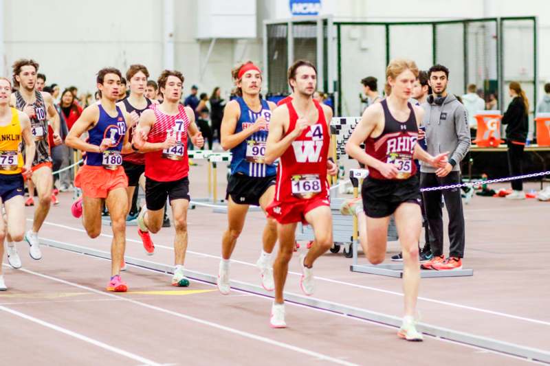 a group of people running on a track