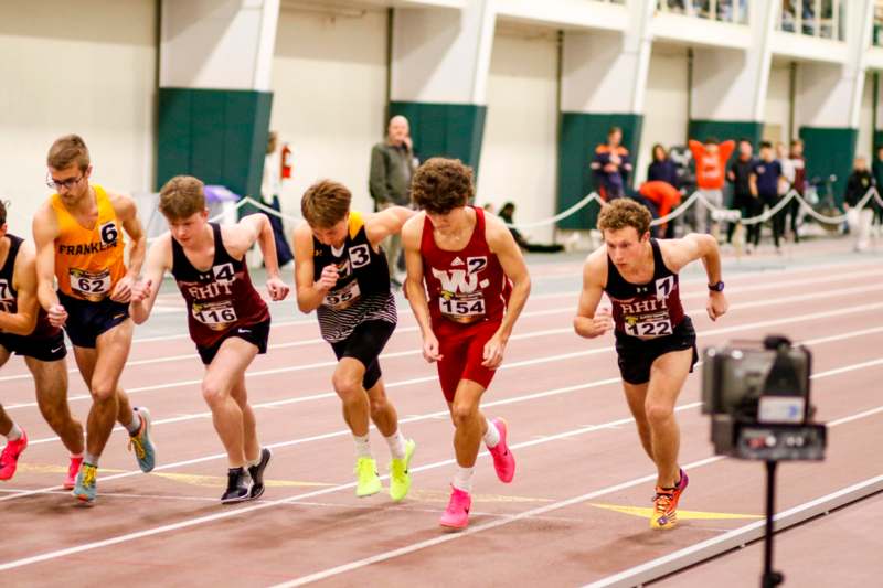 a group of people running on a track