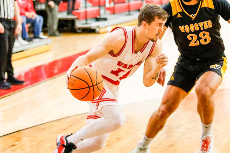 a basketball player dribbling a basketball